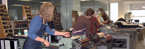 letterpress students running the vandercook presses
