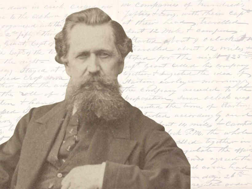 ohn Boylston Fairbanks sits in front of collections of his diary entries.