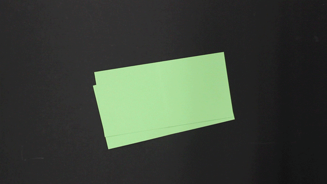 Fold both sheets of green paper in half. These will be your covers.