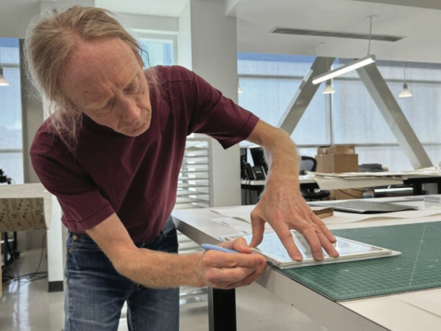 Jeff Hunt preserving a book