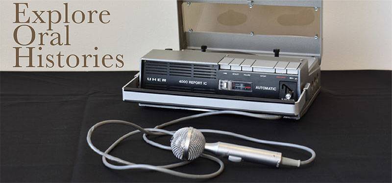 Photograph of a tape recorder and microphone with text reading Explore Oral Histories