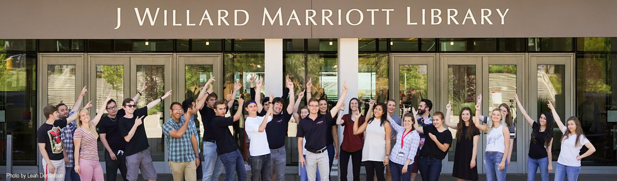 students pointing to the marriott library
