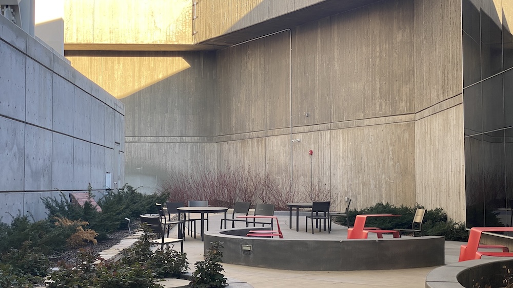 another angle of the outdoor seating area with tables and chairs