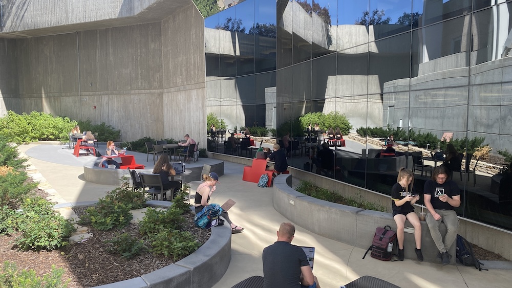 outdoor seating area with tables and chairs. partially shaded during morning and afternoons.