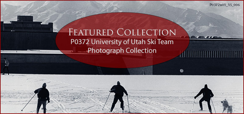 A black-and-white photograph from the 1970s of three figures from the University of Utah ski team practicing skiing on the University of Utah campus. A fluffy dog accompanies them. The roofs of university buildings are visible and behind them, the mountains. The text reads: “Featured Collection P0372 University of Utah Ski Team Photograph Collection.”