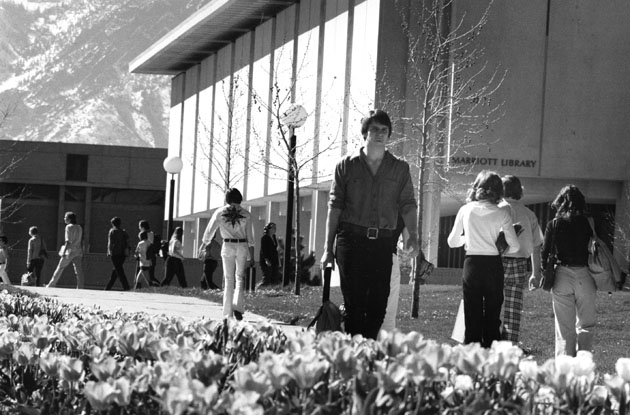 students walking in front of the library