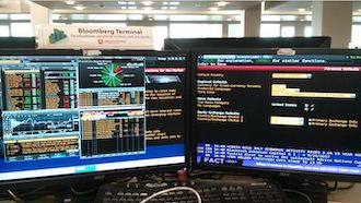 Computer monitors showing the Bloomberg Terminal