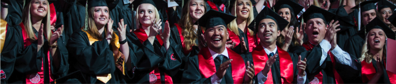 students wearing graduate caps and gowns